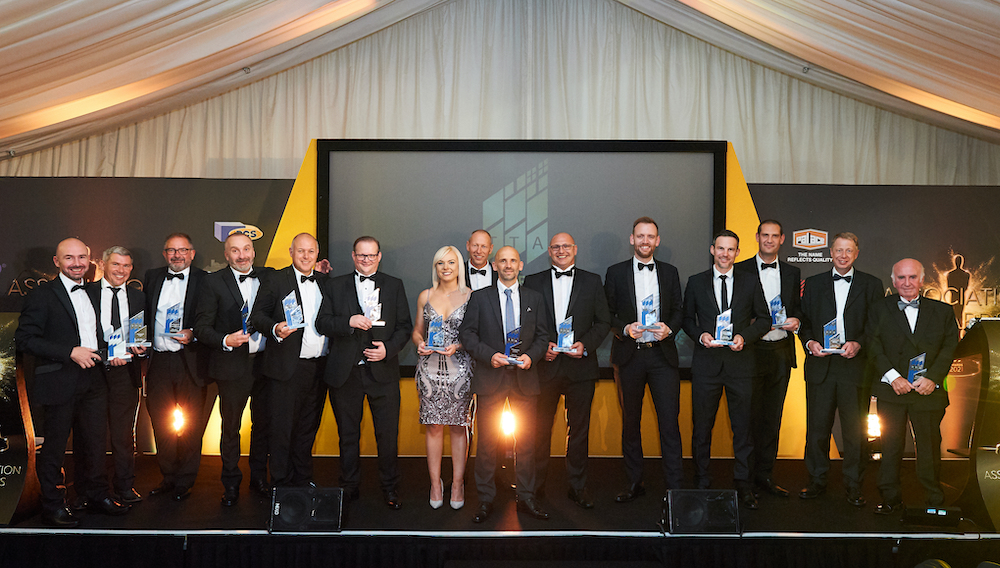 jackon team as gold sponsor of TTA awards 2022 lined up with trophies